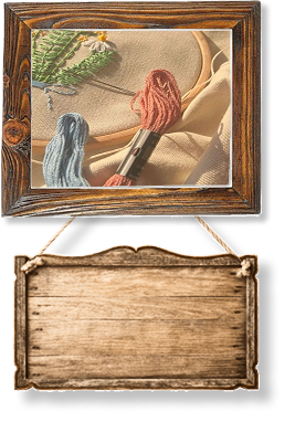 A close up of some embroidery thread in a wooden frame.