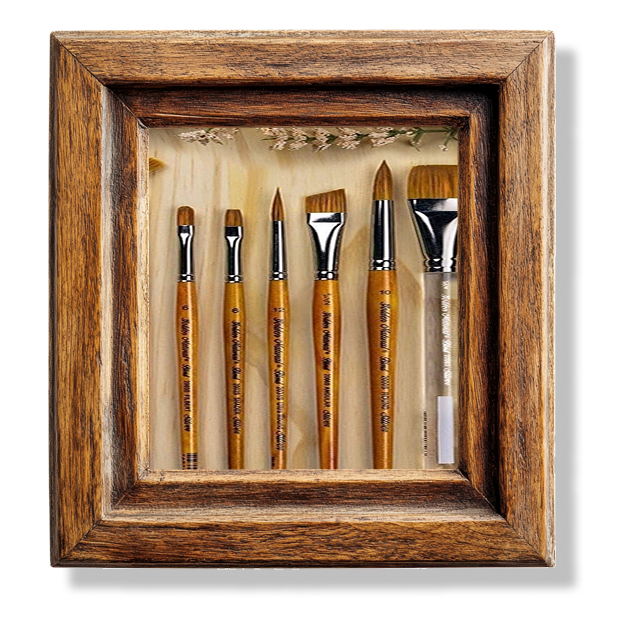 A close up of six different shapes and sizes of paintbrush in a wooden frame.